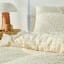 Linen House Ferrara Duvet Cover Set in Sand - King detail on the bed