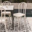 Hertex HAUS Luka Outdoor Chair - Cr�me on a rug outdoor