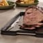 Joseph Joseph Cut and Carve Plus Chopping Board, Extra Large - Black with steak