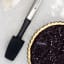 MasterClass Soft Grip Stainless Steel Jar Spatula, 28cm on the table with baked pie