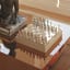 Printworks Mirror Chess on coffee table