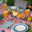 India Ink Garden of Eden Coral Tablecloth - 8 Seater on the table