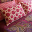 India Ink Carpet Design Kantha Stitched Throw - Magenta on the bed