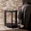 Hertex HAUS Vow Side Table - Onyx next to a bed