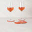 Project Dyad Contour Coaster, Set of 4 - Coral on the table with wine glasses