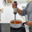 Kenwood Hand Blender with Whisk & Masher, HBM60.007GY with gravy in a pot