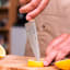 Wusthof Classic Asian Utility Knife, 12cm slicing a lemon