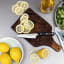 Wusthof Classic Asian Utility Knife, 12cm on the chopping board with sliced lemons