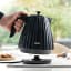 DeLonghi Ballerina Cordless Kettle, 1.7L - Furnace Black on the kitchen counter 