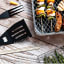 ChefAid Braai Spatula With Serrated Edge with food on the table