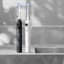 Usmile Sonic Electric Toothbrush Y10 with Feedback Display - Black with a white Usmile Sonic Electric Toothbrush Y10