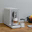 Smeg Smeg Bean-to-Cup Automatic Coffee Machine with a Milk System - Matt White on the table with coffee