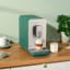 Smeg Bean-to-Cup Automatic Coffee Machine with a Milk System - Matte Emerald Green on the counter