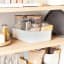 Umbra Bellwood Stackable Bin - Medium on a kitchen shelve