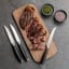 Sagenwolf Carbon Series Steak Knives, Set of 4 on the table with meat