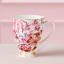 Maxwell & Williams Estelle Michaelides Enchantment Footed Mug, 300ml on the table