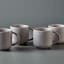 Maxwell & Williams Palette Mugs, Set of 4 - Grey on the table