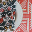 Caversham Textiles Christmas Geometric Paper Placemats - A3 on the table with a plate