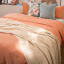 Thread Office Knitted Cotton Throw - Ivory on the bed