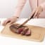 Brabantia Profile Wooden Chopping Board for Meat on the kitchen counter