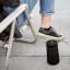 Bose SoundLink Revolve 2 Bluetooth Speaker - Triple Black next to a chair