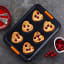 Le Creuset Non-Stick Heart Muffin Tray, 6 Cup on the kitchen counter with cup cakes