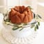 Nordic Ware Magnolia Bundt Pan, 10-Cup on the table