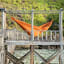 Ticket To The Moon Large Home Hammock - Terracotta Orange by the deck
