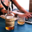 Deanston  12-Year-Old Single Malt Scotch Whisky, 700ml on the table with a laptop