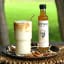 Luckybird African Ginger Syrup - 250ml with a smoothie on the table