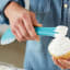 Wilton Versa-Tools Silicone Spread and Scoop Spoonula with cream