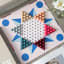 Printworks Play Chinese Checkers on the table