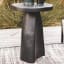 Hertex HAUS Aruba Outdoor Side Table - Carbon with a jug and glass of water