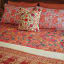 India Ink Red Bird of Paradise Kantha Stitched Throw - Double on the bed