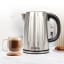 Milex Silverline Stainless Steel Kettle, 1.7L with a cup of coffee