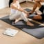 Eufy A1 Body Analysis Smart Scale - White next to a yoga mat