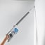Taurus Ultimate Go Cordless Vacuum Cleaner cleaning the corner of the wall