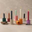 Alkaline Small Ribbed Candle Holders with candles lit