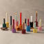 Alkaline Small Ribbed Candle Holders with candles lit