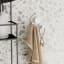 Umbra Flex Adhesive Double Hook - White against wall with towel