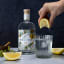 IndiGINous Zest Gin, 750ml - Lifestyle with lemon being squeezed 