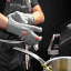 Meater Braai & Oven Mitts, Set of 2 - Grey next to a barbecue grill