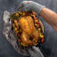 Meater Braai & Oven Mitts, Set of 2 - Grey with a tray of roasted chicken