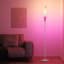 Govee RGBICWW Cylinder Floor Lamp next to a couch