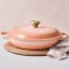 Le Creuset Peche Signature 3.5 Litre Shallow Casserole, 30cm on the table