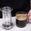 AeroPress Flow Control Filter Cap on the table with coffee