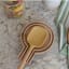 KitchenCraft Idilica Beechwood Spoon Rest with a spoon on the kitchen counter