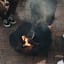 Sprung Outdoor Living Fire Rose Fire Pit with fire wood