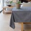 Linen House Revana Chambray Black Tablecloth small with a plant on the table