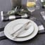 Linen House Revana Check Napkins, Set of 4 - Black on the table with plates